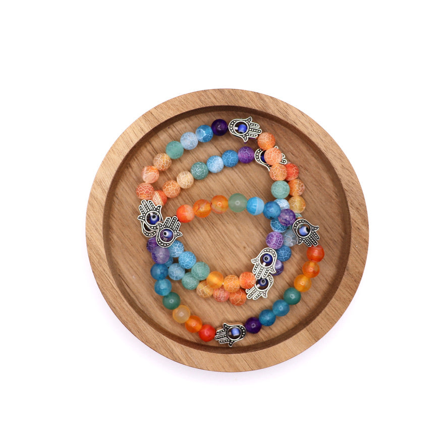 7 chakra bracelets made with cracked agate beads and fatima hand (hand of hamsa) charms